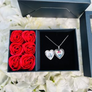 Silver heart shaped locket with paper box