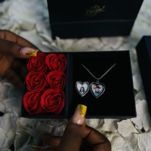 Silver heart shaped locket with paper box