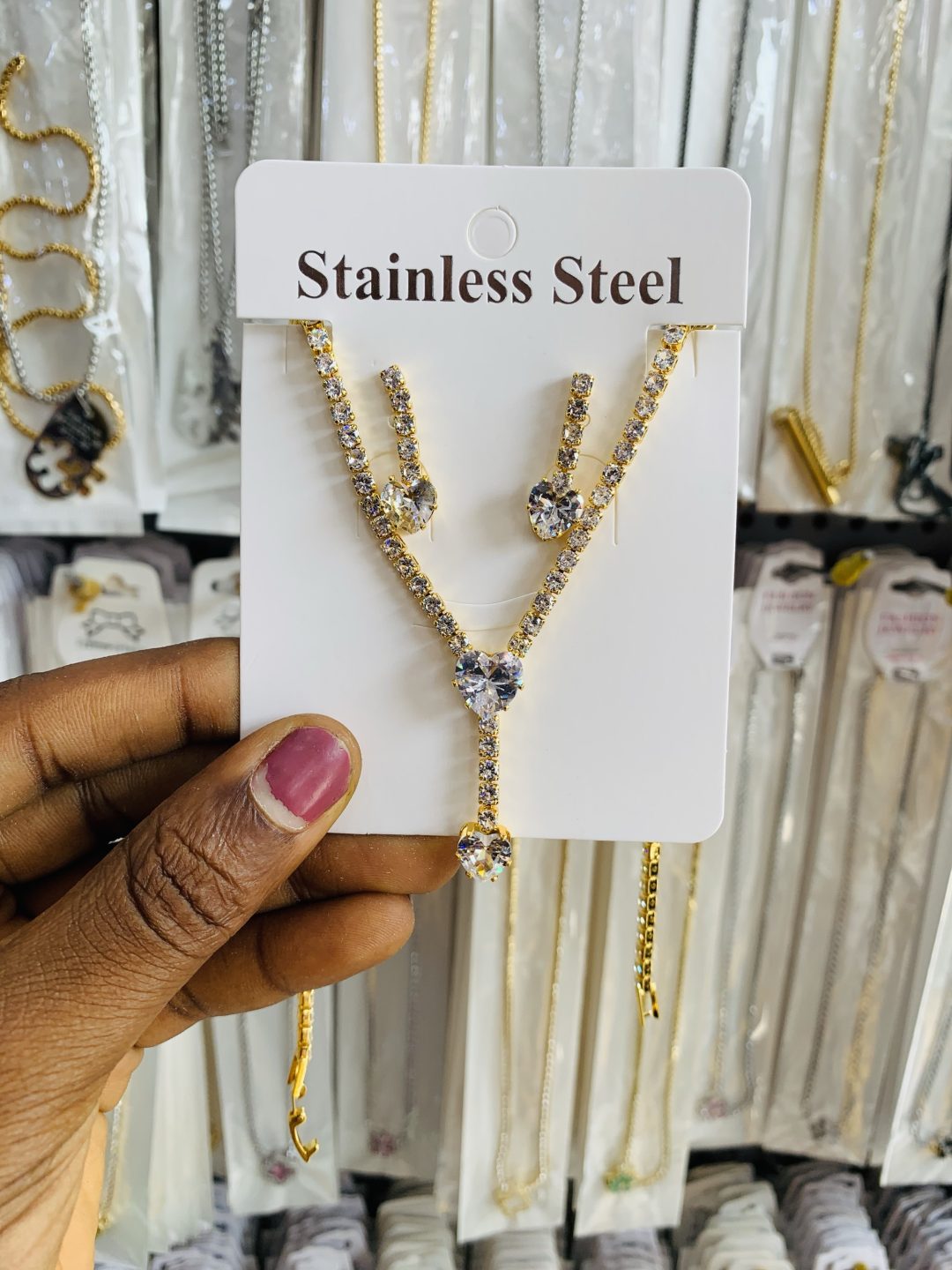 Gold tennis dropping heart shaped necklace