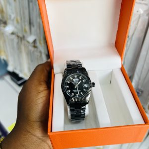 Engraved female black Rolex watch