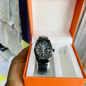 Engraved female black Rolex watch
