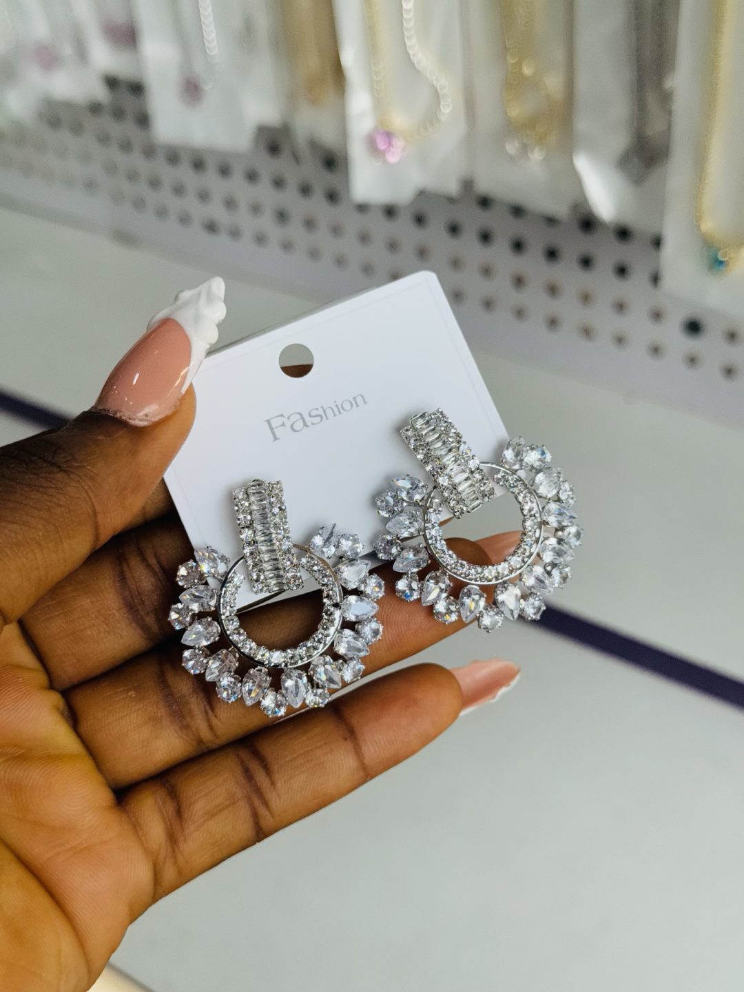 Silver pear statement earrings