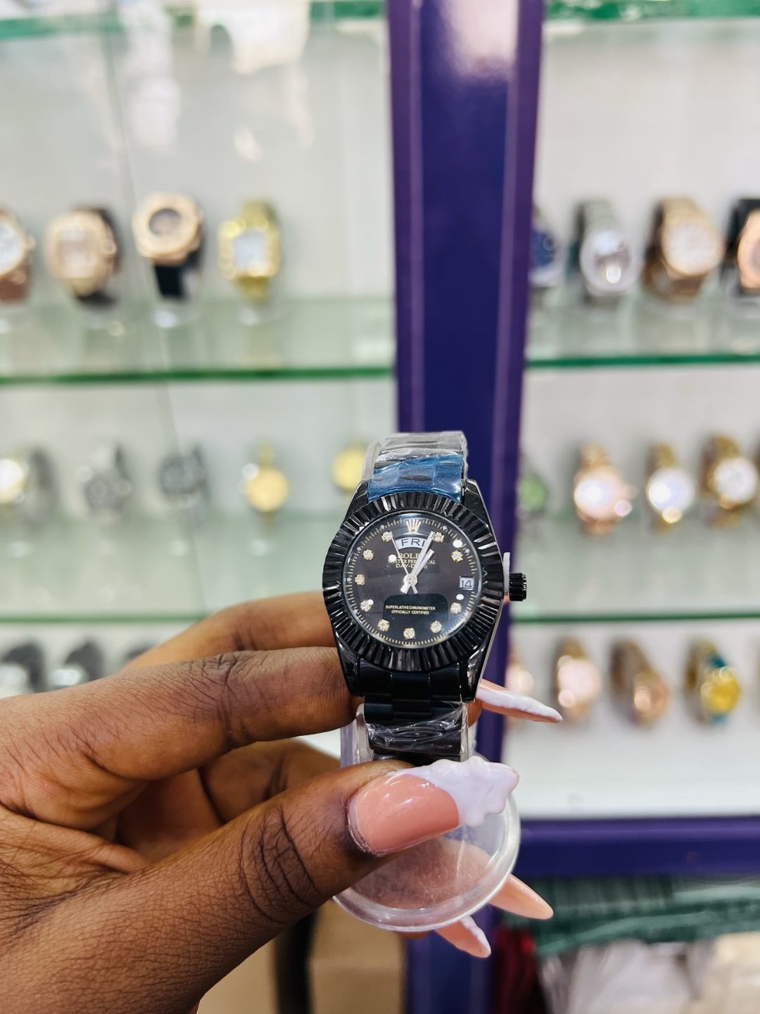 Black female Rolex watch