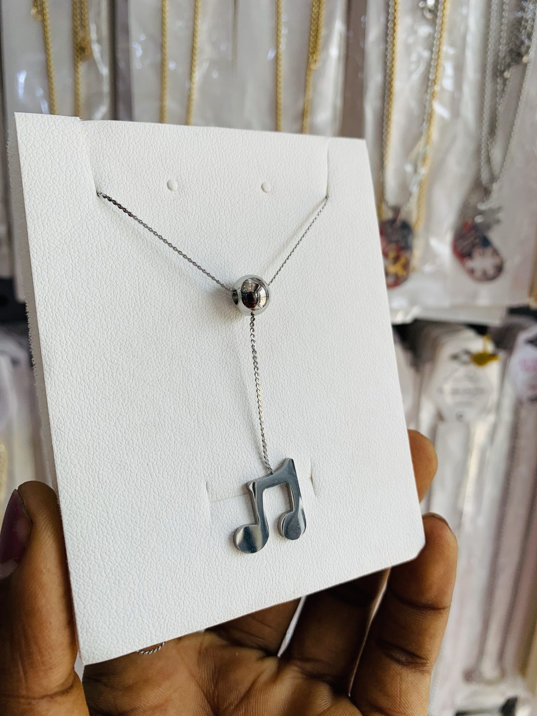 Lyrical ball necklace