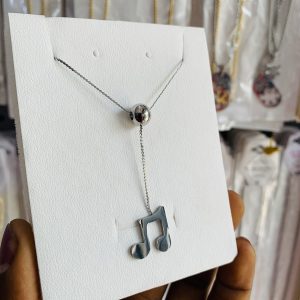 Lyrical ball necklace