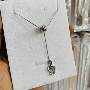 Clef ball necklace