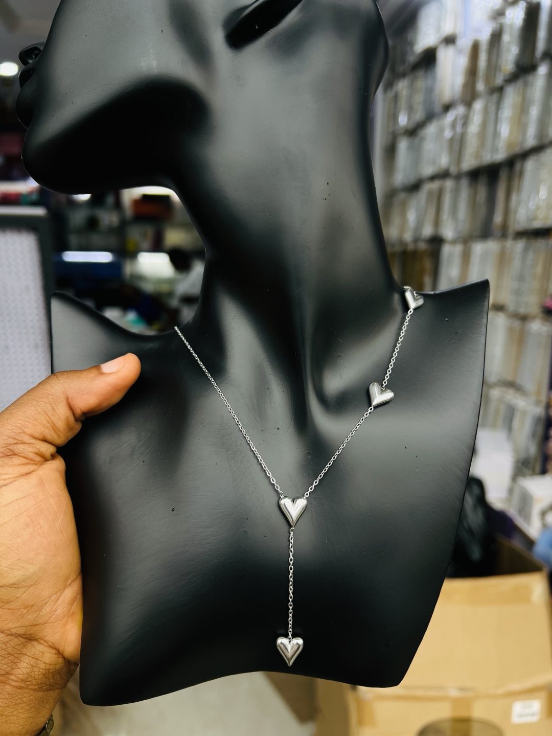 Silver dropping 4 heart necklace