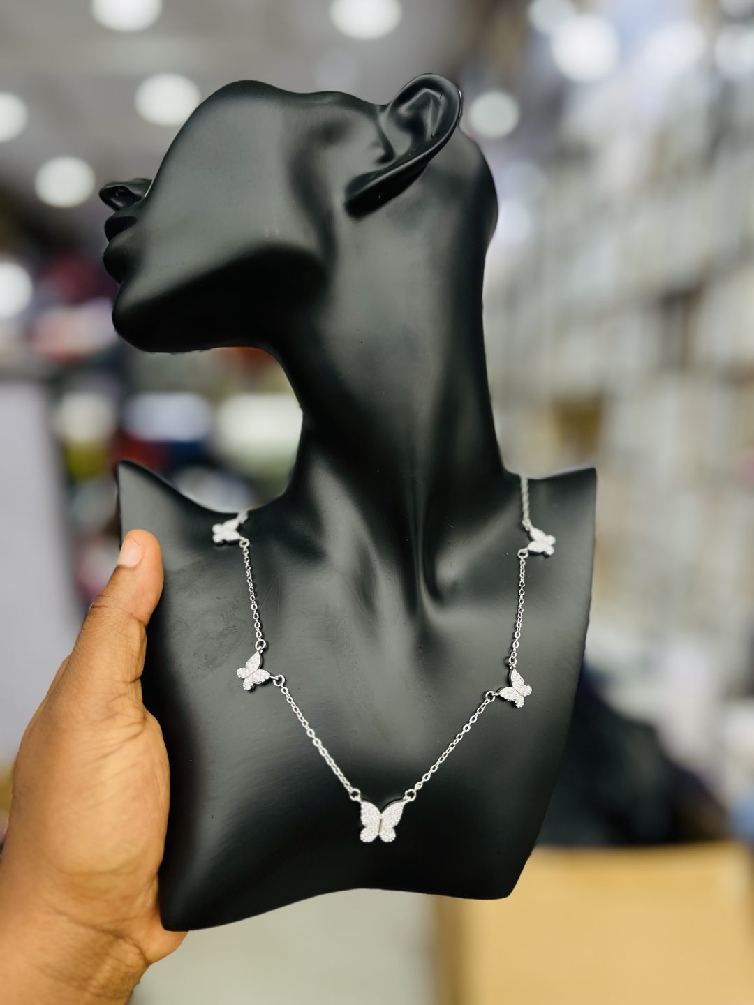 Five butterfly round silver necklace