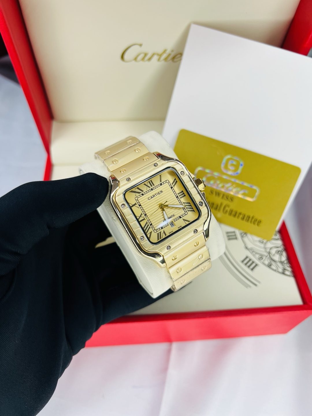 Gold Cartier tank watch with branded box and bag!