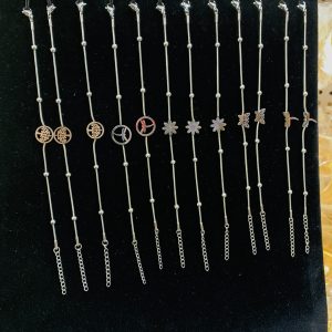 A dozen of mixed steel silver bracelets