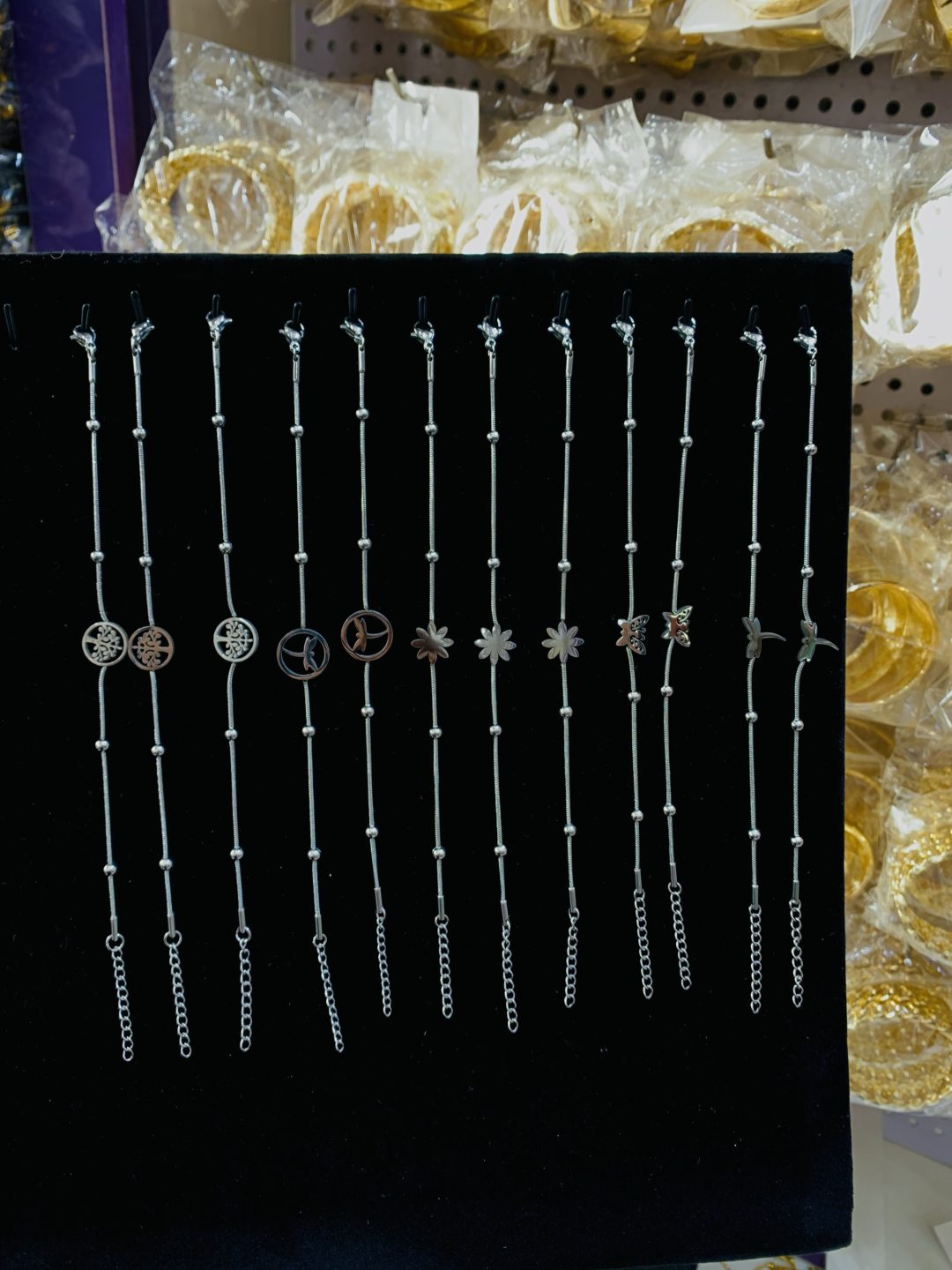 A dozen of mixed steel silver bracelets