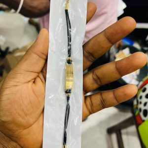 Engraved black flat drawstring bracelet with paper box