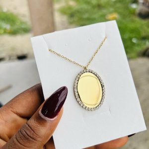 Engraved gold oval stoned necklace