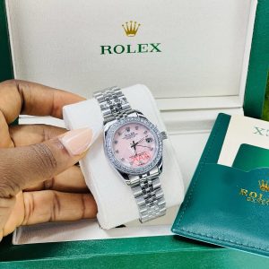 Rolex stoned pink face silver watch with exact box and bag!
