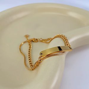 Engraved gold double flat bracelet