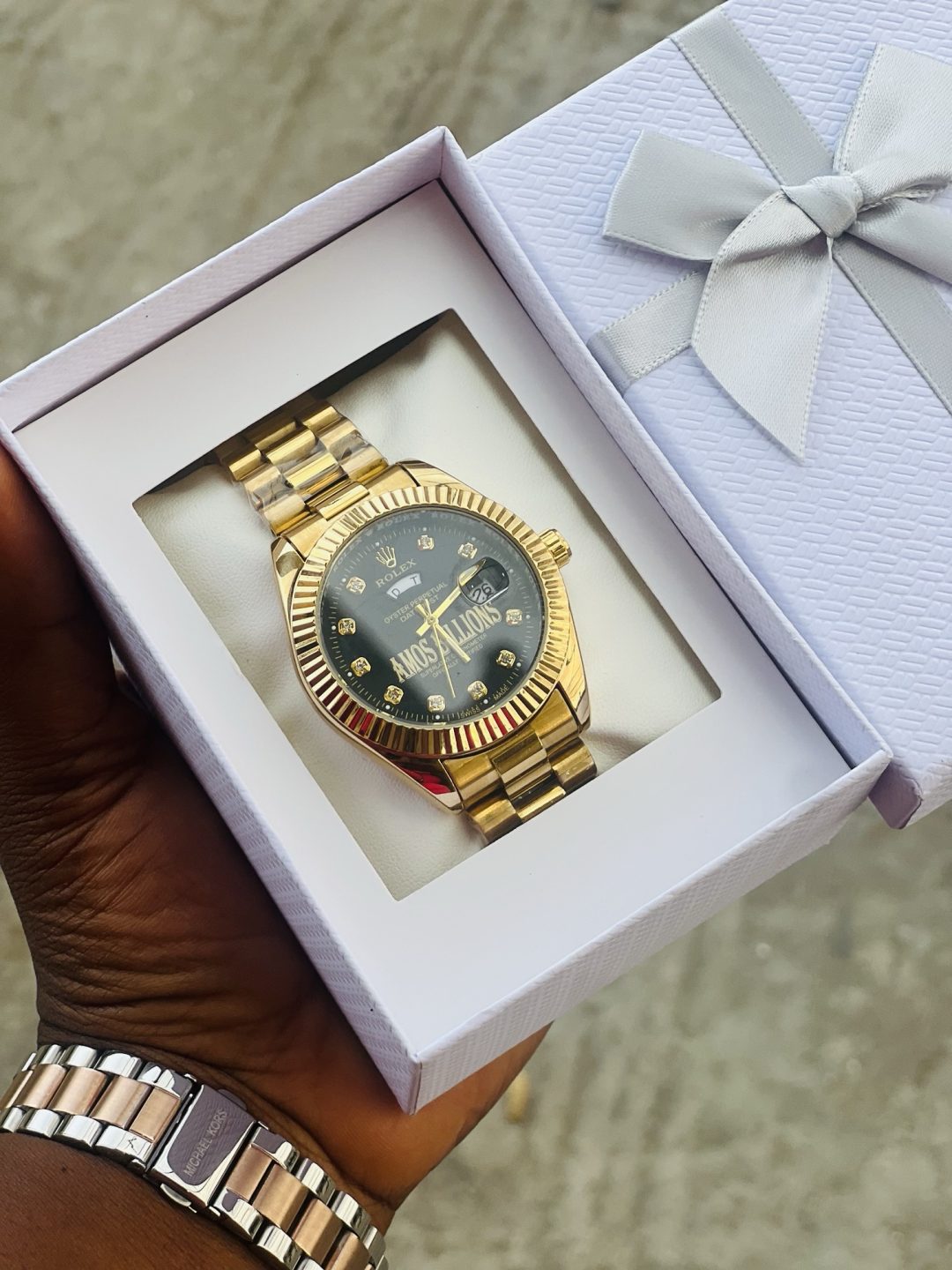 Engraved Gold black face Rolex watch