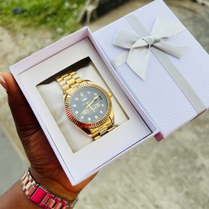 Engraved Gold black face Rolex watch