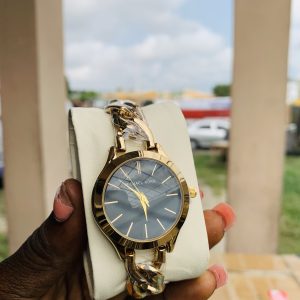 Micheal Kors gold black face
