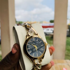 Micheal Kors gold black face