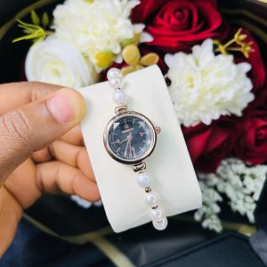 Rebirth pearls rose gold black face dropping watch