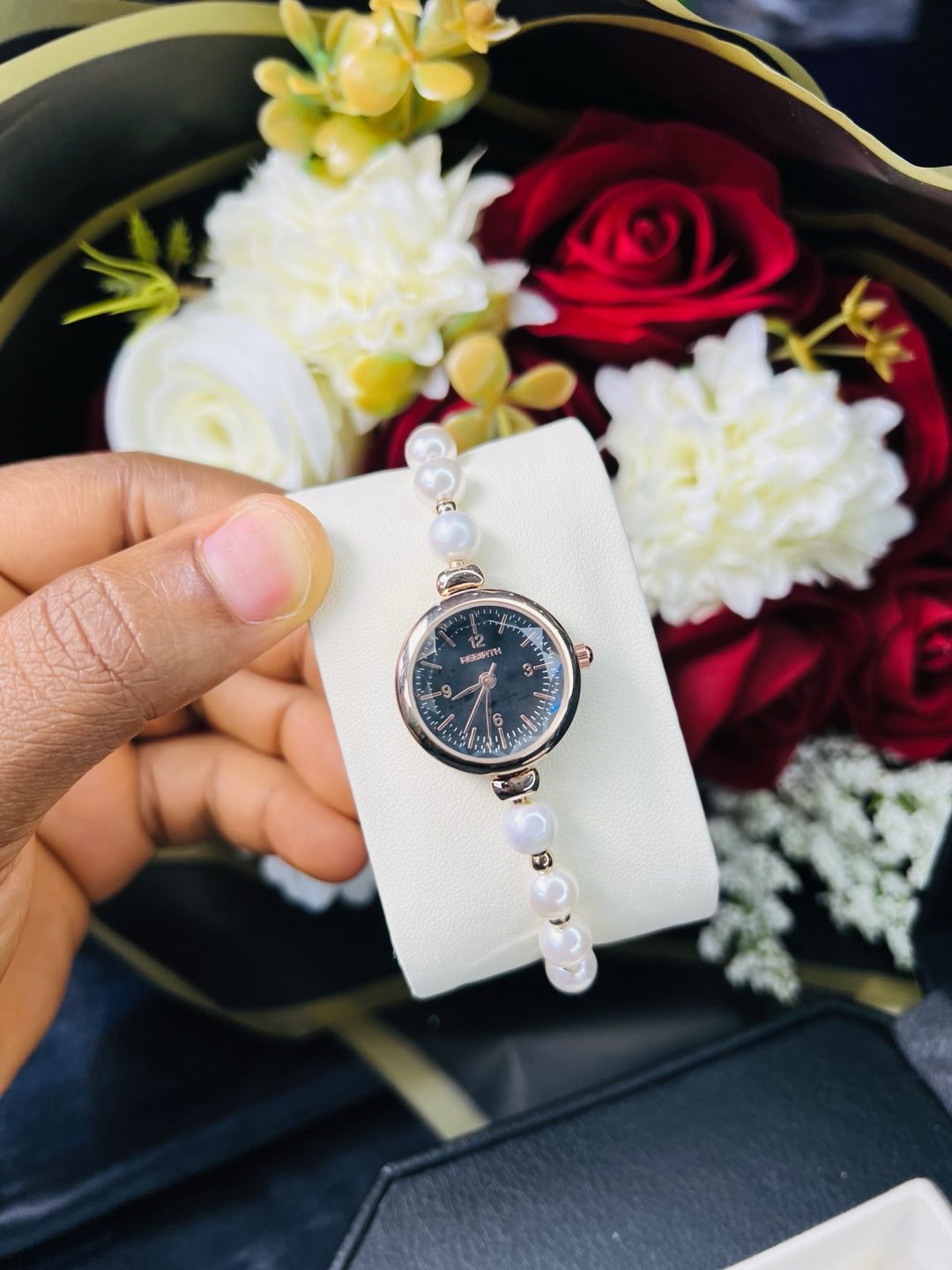 Rebirth pearls rose gold black face dropping watch