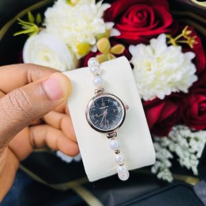 Rebirth pearls rose gold black face dropping watch
