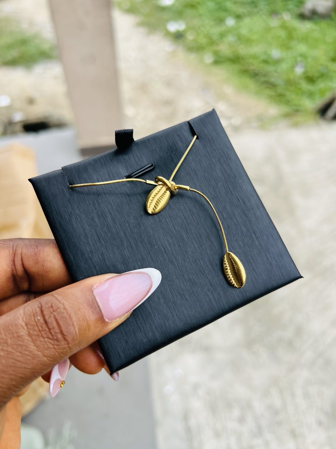 Drawstring cowries necklace