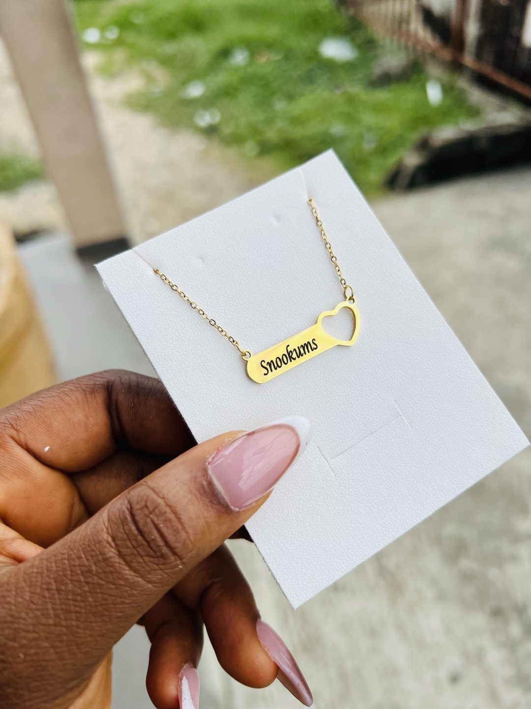 Engraved female necklace with open heart