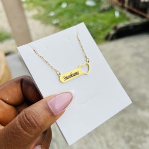 Engraved female necklace with open heart