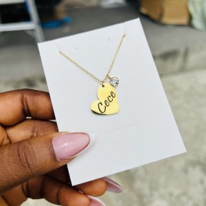 Engraved female heart necklace with gemstone