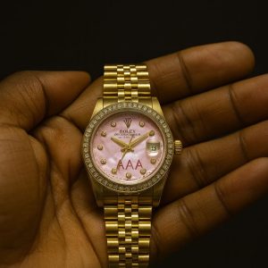 Rolex oyster gold/pink face