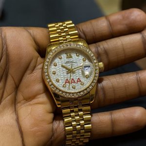 Rolex oyster gold/white face