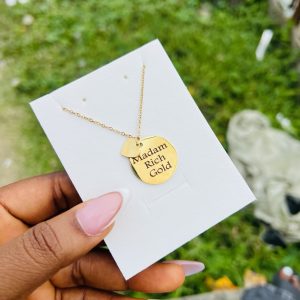 Engraved circle necklace with love charm