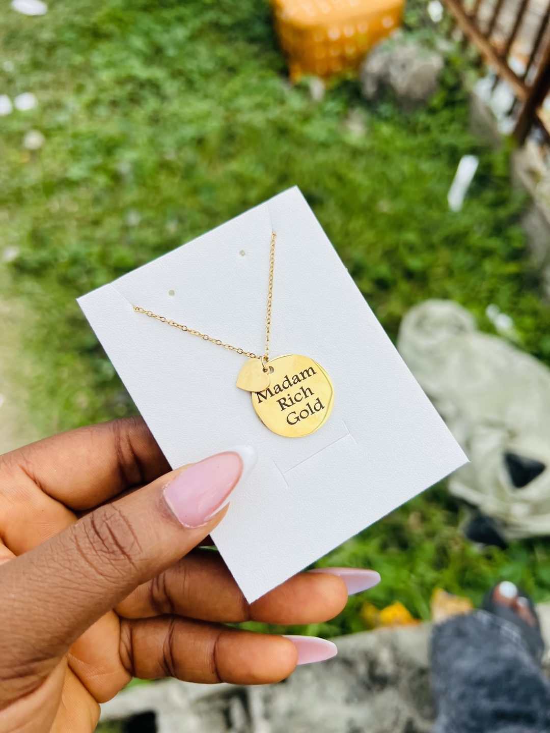 Engraved circle necklace with love charm