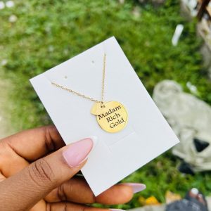 Engraved circle necklace with love charm