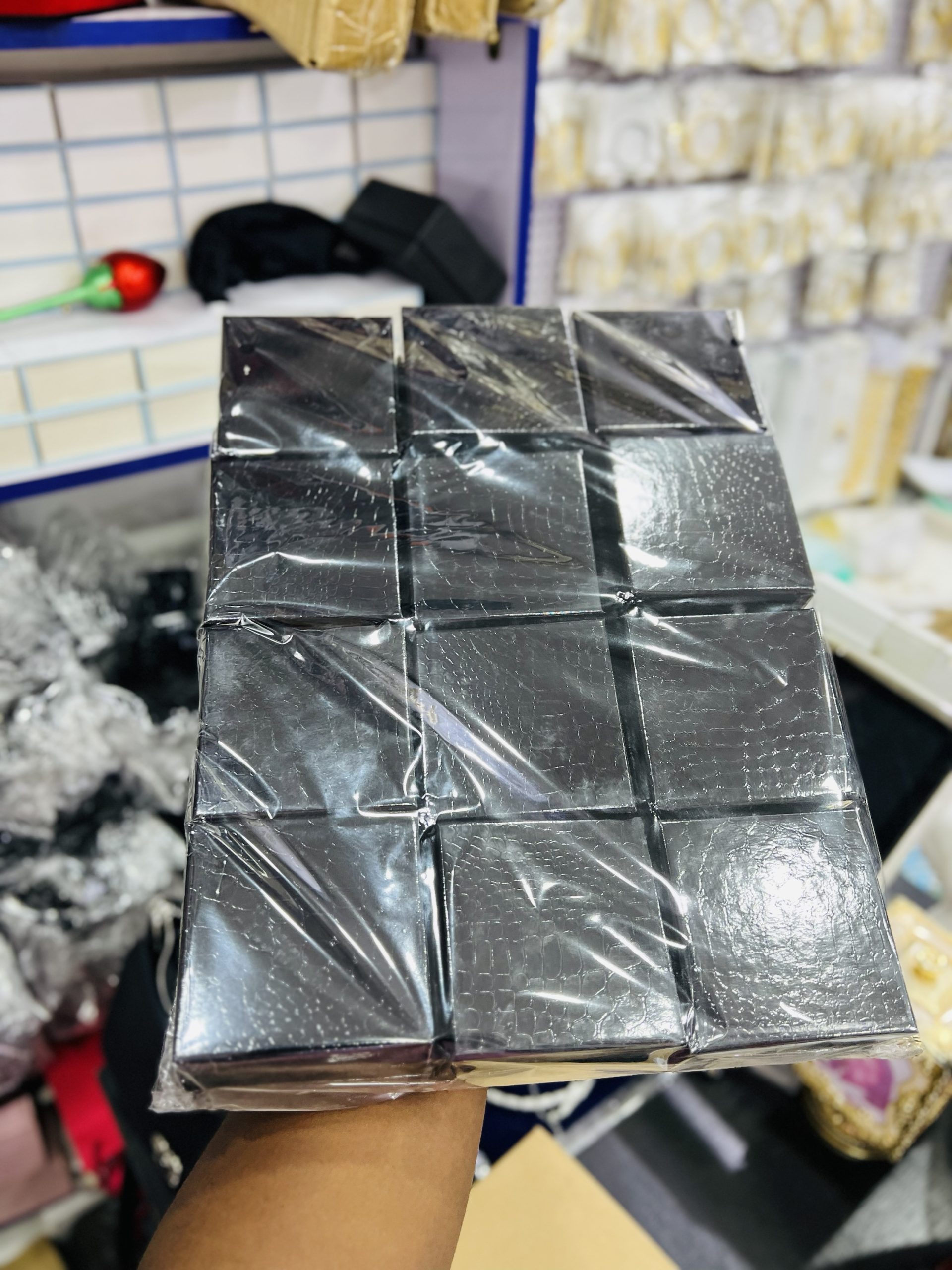A dozen of black shiny foam box