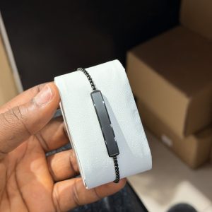 Engraved black brush bracelet with paper box