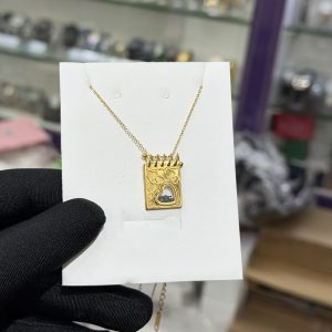 Engraved gold black locket necklace with paper box