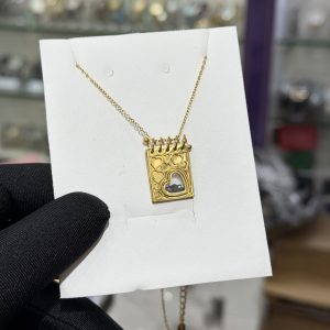 Engraved gold black locket necklace with paper box