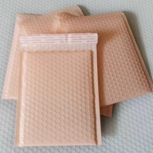 A dozen of peach small sized poly bubble mailers