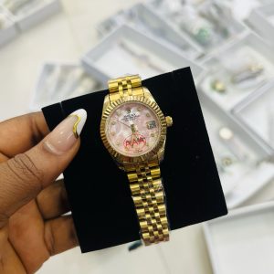 Rolex gold stoned pink face