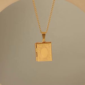 Gold booklet locket necklace with paper box