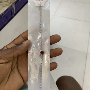 Silver bracelet with red stone