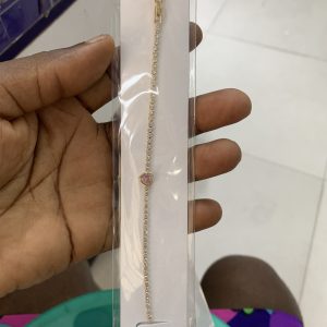 Small gold bracelet with pink stone