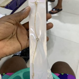 Tiny gold bracelet with silver stone