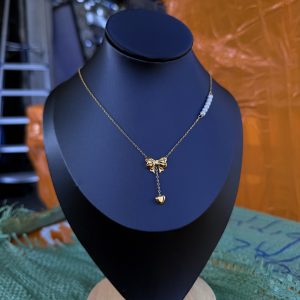 Bow tie beaded steel necklace