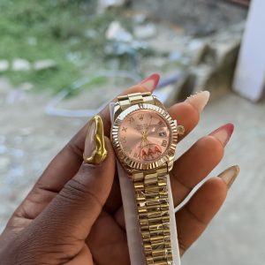 Roman gold pink face female  Rolex watch