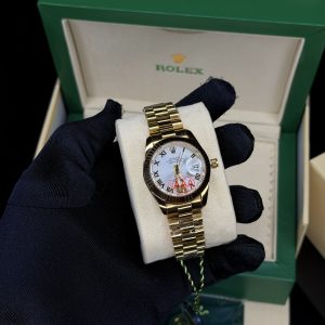 Roman gold white face female Rolex watch