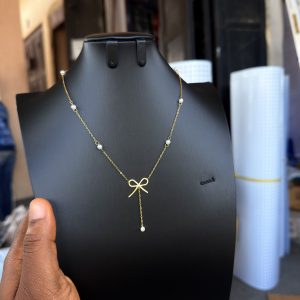 Steel dropping bowtie necklace