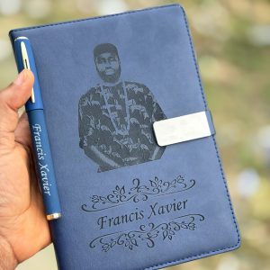 Engraved blue leather book and pen